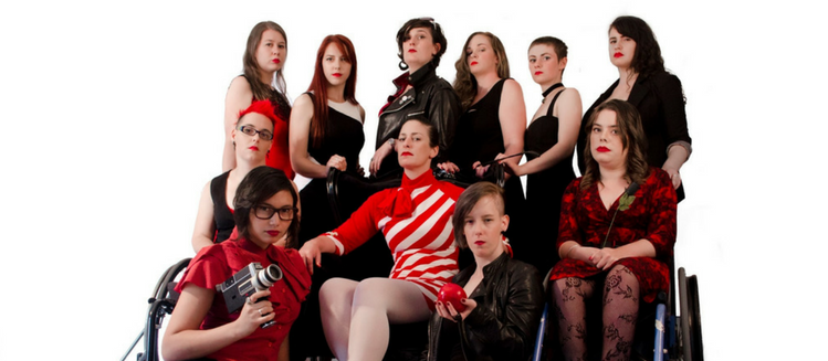 Group of ten women dressed in black and red looking into camera with serious faces