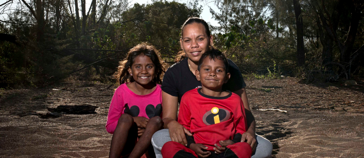 First Nations woman with two children